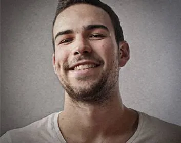 a man smiling at the camera